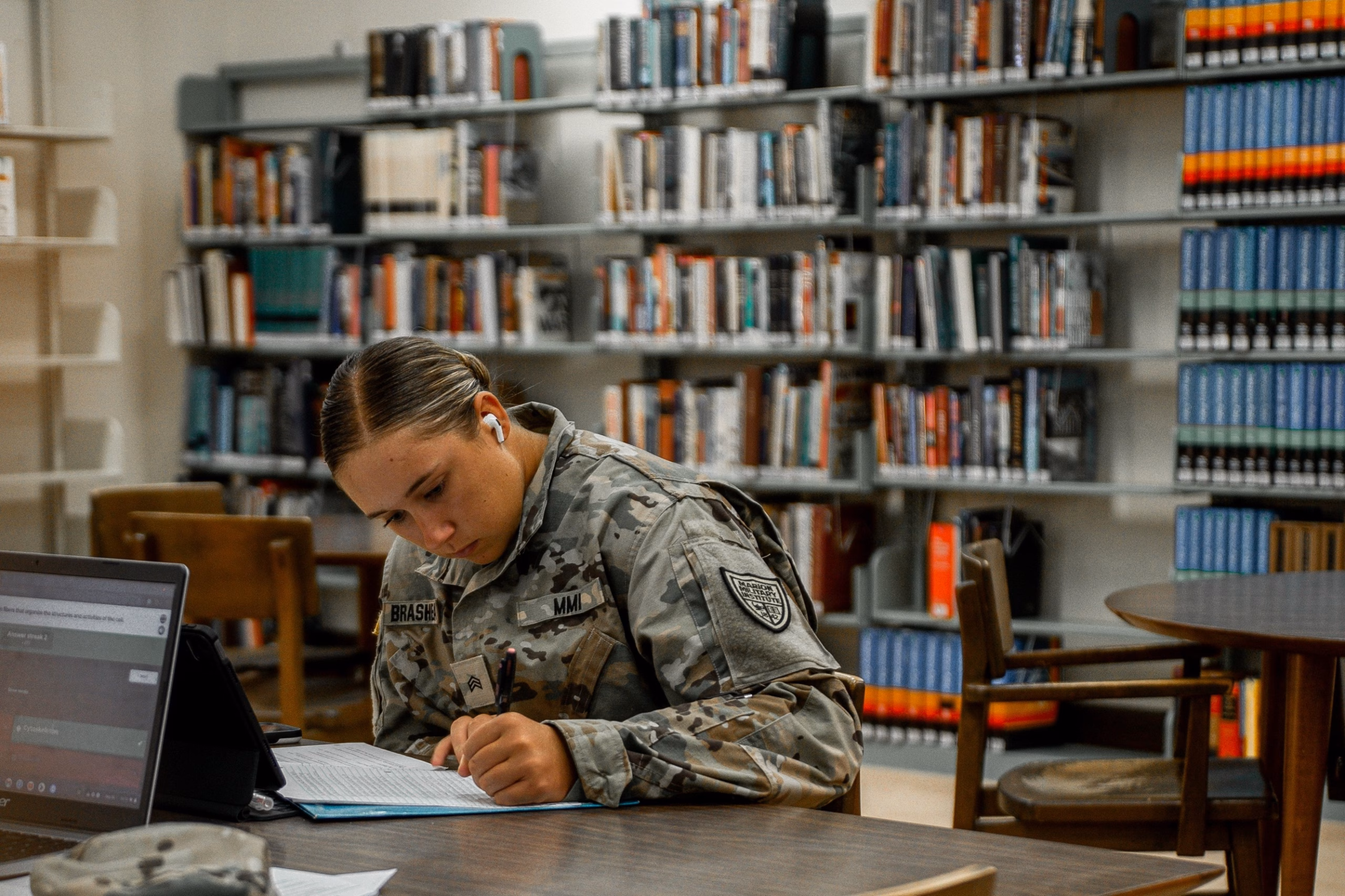 female cadet studying in the library